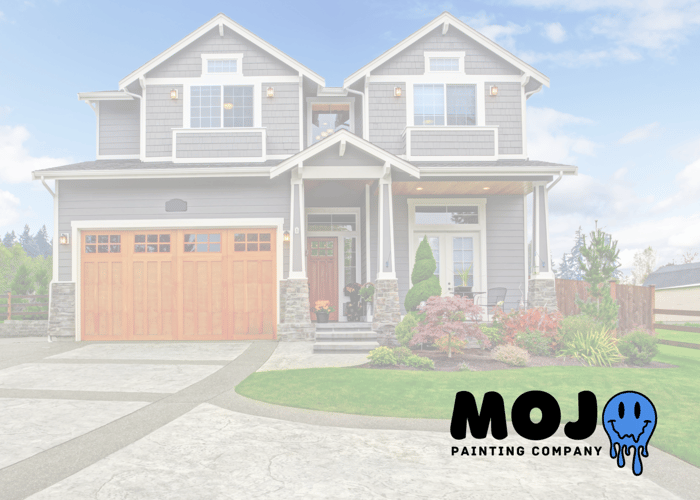 Freshly painted home exterior with gray siding and wood-tone garage in Downingtown, PA — summer painting tips from Mojo Painting Company serving Chester County.