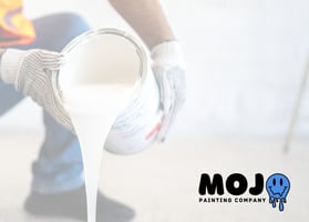 phoenixville local house painters in work gloves pouring white paint from a large can onto the floor